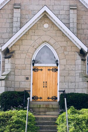 Limestone bricked church with midevel style, arched doorwayの写真素材