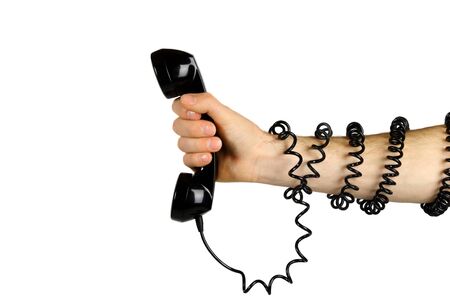 Hand gripping telelphone with cord wrapped around his arm.