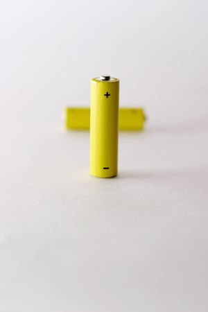 Two yellow AA battery