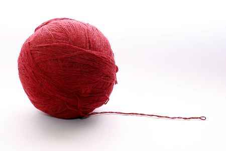 Close up shot of ball of red threads for the bindingの写真素材