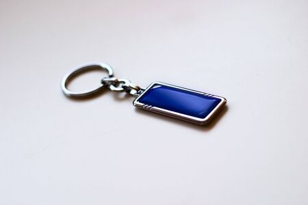 Decorative chrome charm for keys on white background. Place your logoの写真素材