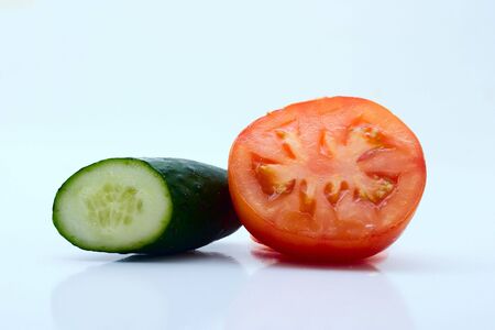 Vegetables on a light background: cucumber, tomatoの写真素材