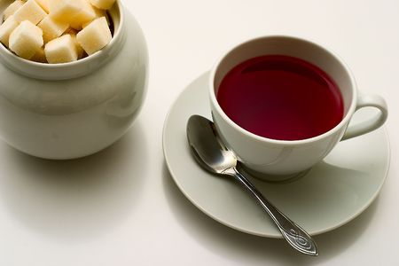 Cup of tea and sugar on grey background.の写真素材