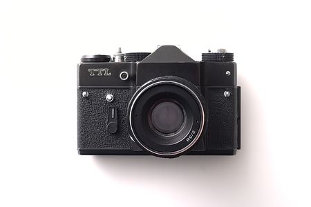 Old film camera isolate on a white background