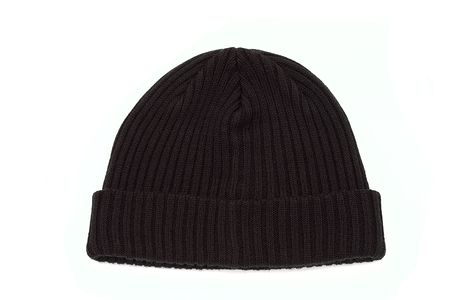 Men's knitted black hat isolated on a white backgroundの写真素材