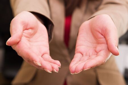 The two women's hands outstretched to the audience.の写真素材