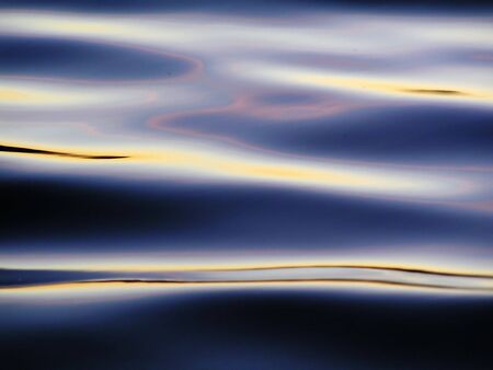 Colorful reflection in dark waves of pound