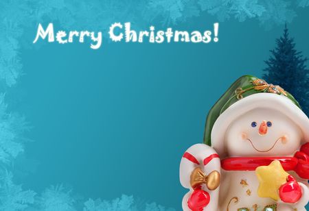 Christmas greeting card with a snowman, a xmas tree and ice frostの写真素材