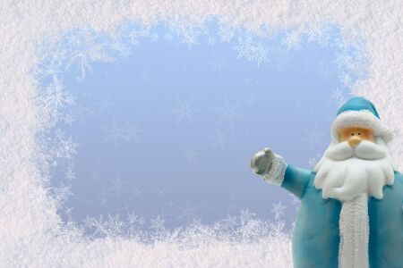 Postcard greetings for the New Year with snow and Santa Claus. Space for textの写真素材