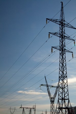High-voltage power lines against the sky. Industrial background for appropriate purposesの写真素材