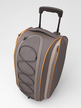 Grey travel bag close up  on light backgroundの写真素材