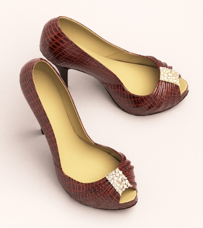 Crocodile leather women's shoes with high heels close up on a light backgroundの写真素材
