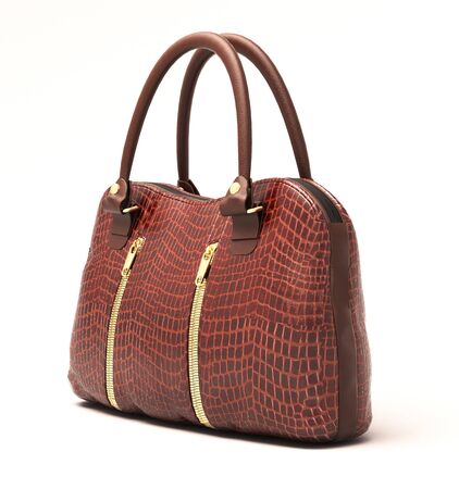 Crocodile leather women's handbag isolated on white backgroundの写真素材