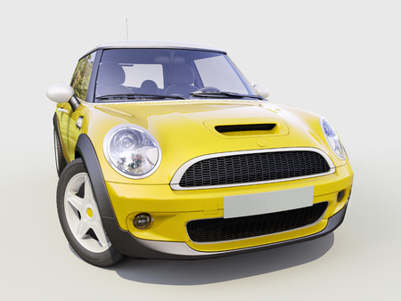 Modern compact city car on a gray backgroundの写真素材