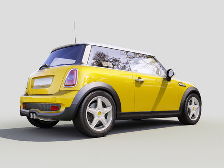 Modern compact city car on a gray backgroundの写真素材