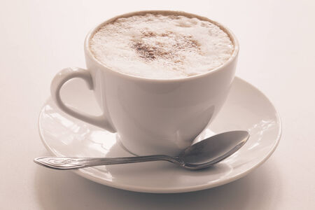 Cappuccino cup on a light background. Shallow depth of fieldの写真素材