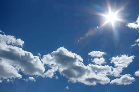 A clear sky at noon, the sun is in the frame