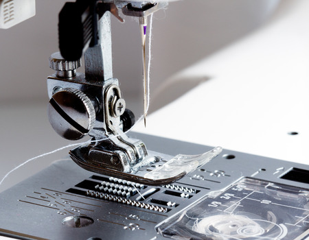 Close-up of modern sewing machine footの写真素材