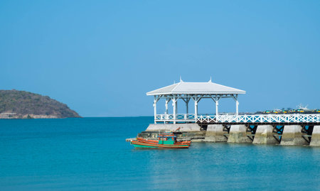 The boat and Atsadang Bridge, Koh Sri Chang, Chonburi province, Thailand.の写真素材