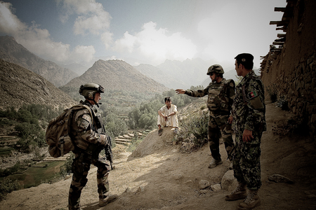 Kabul, Afghanistan - March 10, 2011.Legionnaires of the French foreign legion with arms in the village with local resident during the military operation in Afghanistan.のeditorial素材
