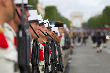 Paris. France. July 14, 2012. Rows of foreign legionaries of the French foreign legion against the background of the triumphal arch during the parade on the Champs Elysees in Paris.のeditorial素材