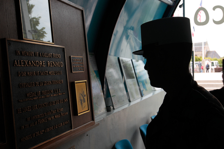 France, Normandy, June 6, 2011 - The Legionnaire of the French foreign legion is studying the document in the museum of the military operation in 1944 during the landing of the Allies in Normandy.のeditorial素材