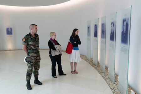France, Normandy, June 6, 2011 - Visitors study documents at the 1944 military operation museum during the landing of the Allies in Normandy.のeditorial素材