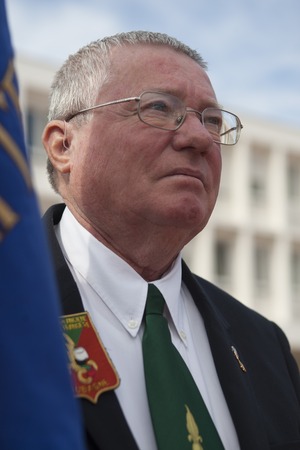 Aubagne, France. May 11, 2012. Portrait of a veteran of the French foreign legion with the banner of veterans .のeditorial素材