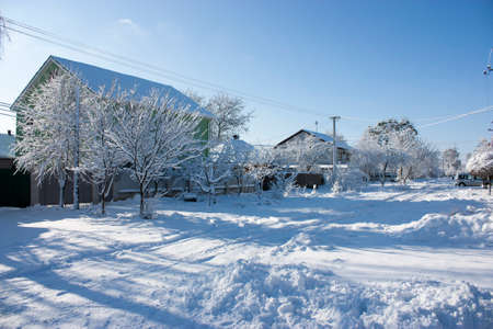 Winter street in the snow, a sunny winter day, at homeの写真素材