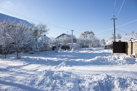 Winter street in the snow, a sunny winter day, at homeの写真素材