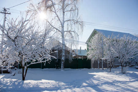 Winter street in the snow, a sunny winter day, at homeの写真素材