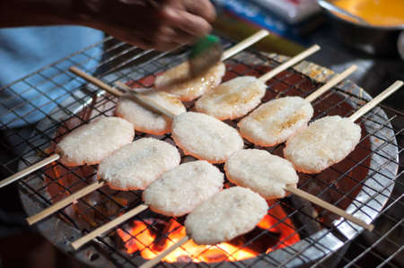Sticky rice grilled on stove, tasty snack north-east thai cold weatherの写真素材