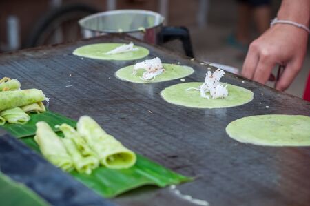 Close up Cooking pan Thai sweetmeat made of green flour, coconut milk and egg, Thong Muan Sodの写真素材