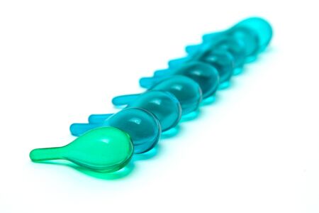 Vitamin serum capsule with a white background.の写真素材