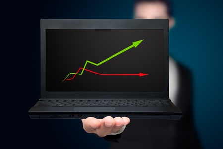 laptop with business or profits growth graph.