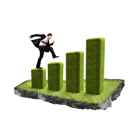 Businessman with growth chart of profits.の写真素材