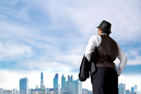 Businessman looking something in city.の写真素材