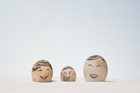 abstract family stones on the sand background.の写真素材