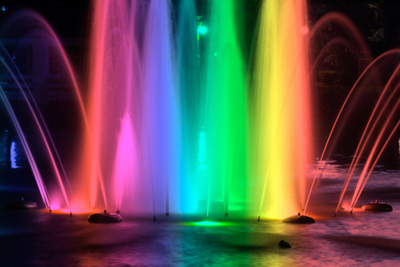 Colorful fountains at night in the park.の写真素材