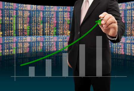Investor with growth chart of profits.の写真素材