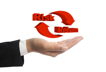 Risk and return symbol on hands.の写真素材