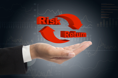 Risk and return symbol on hands.の写真素材