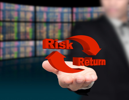 Risk and return symbol on hands.の写真素材