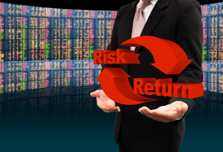 Risk and return symbol on hands.の写真素材