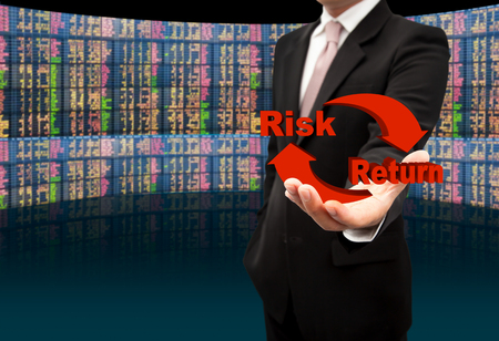 Risk and return symbol on hands.の写真素材