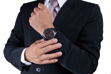 Businessman with wrist watch isolated on white.の写真素材