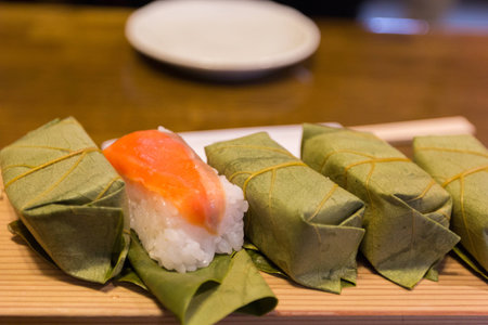 Salmon sushi wrapped in persimmon leavesの写真素材