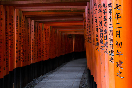 Red Tori Gate at Fushimi Inari Shrine at Kyoto, Japan, selective focus, soft focus and blur imageのeditorial素材