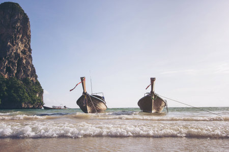 long tail boat on railay beach in Krabi, Thailandの写真素材