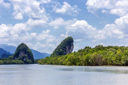 Two small mountain in big river at Krabi, Thailandの写真素材
